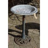 A metal bird bath.