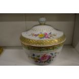A continental porcelain bowl and cover painted with flowers (AF).