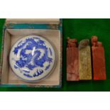 Three Chinese hardstone seals together with a blue and white porcelain inkpot.