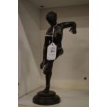 After the antique, a standing bronze female nude.