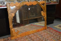 An unusual modern mirror, the carved and stained frame with owl and squirrel.