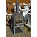 A garden smoker or pizza oven.