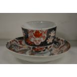 An Imari cup and saucer.