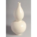 A CHINESE CREAM GLAZE DOUBLE GOURD VASE, 28.5cm high.