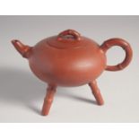 AN UNUSUAL CHINESE YIXING TRIPOD TEAPOT, with impressed marks to inner lid and base, 12cm high.