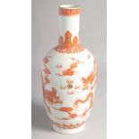A CHINESE CORAL RED AND WHITE PORCELAIN VASE, painted with dragons and the flaming pearl of