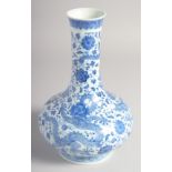 A CHINESE BLUE AND WHITE PORCELAIN VASE, finely painted with dragons and flower heads, the base with