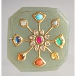 AN INDIAN MUGHAL BEJEWELLED JADE PLAQUE, with gold central floral motif inset with various stones,