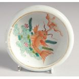 A SMALL CHINESE CORAL RED AND WHITE PORCELAIN BRUSH WASHER, the interior centre painted with a