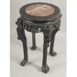 A GOOD CHINESE MARBLE INSET HARDWOOD STAND, with carved and pierced frieze and raised on four claw