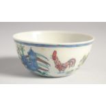 A CHINESE DOUCAI PORCELAIN CUP, painted with chickens, 8cm diameter.