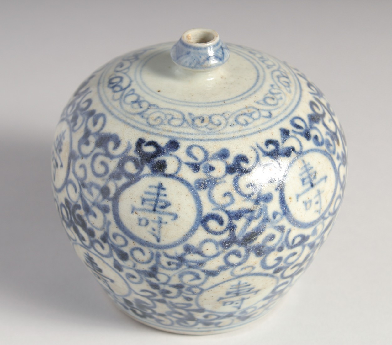 A SMALL CHINESE BLUE AND WHITE PORCELAIN BULBOUS VASE, painted with characters, 11.5cm high. - Image 2 of 6