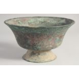 AN EARLY SELJUK BRONZE FOOTED BOWL, inscribed with the name of the owner, possibly 13th/14th