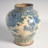 A FINE 17TH CENTURY PERSIAN SAFAVID BLUE AND WHITE GLAZED POTTERY VASE, painted with flora and