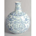 A CHINESE BLUE AND WHITE PORCELAIN MOON FLASK painted with foliate motifs and characters. 29cm high