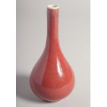 A SMALL CHINESE SANG DE BOEUF BOTTLE VASE, the base with Qianlong mark, 15cm high.