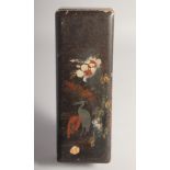 A JAPANESE LACQUERED WOOD RECTANGULAR BOX, the hinged lid decorated with cranes and flora, 30cm x