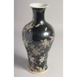 A CHINESE FAMILLE NOIR PORCELAIN VASE, decorated with prunus blossom, 28cm high.