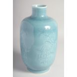 A CHINESE BLUE GLAZE PORCELAIN VASE, with carved floral decoration to the body, the base with six-