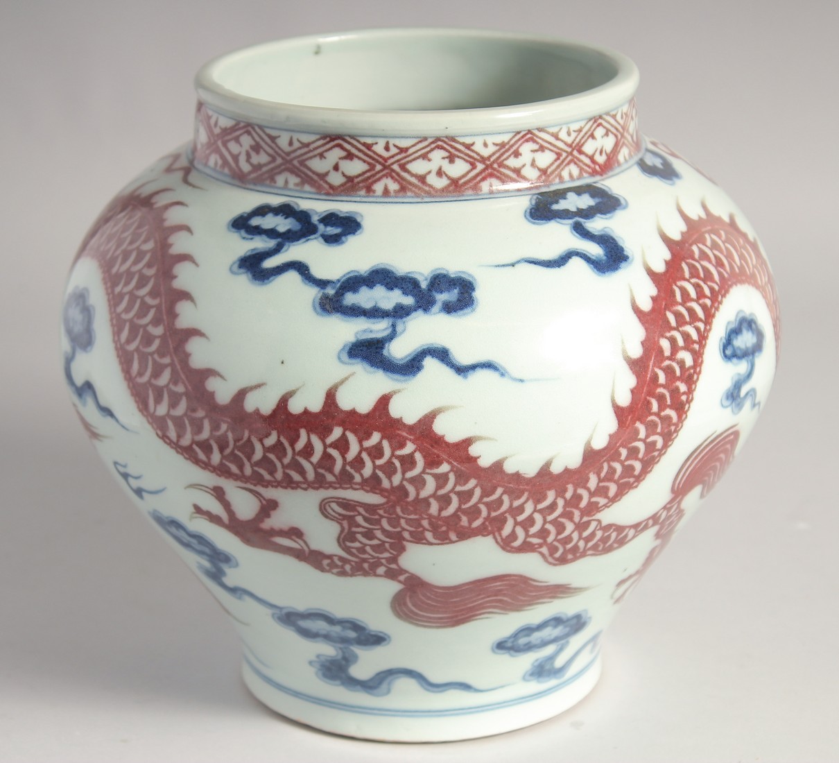 A CHINESE BLUE AND UNDERGLAZE RED PORCELAIN DRAGON JAR, 22cm high. - Image 3 of 7