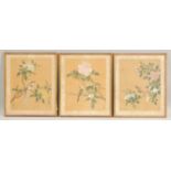 A SET OF THREE CHINESE PAINTINGS ON SILK, each painted with birds and native flora, all with red