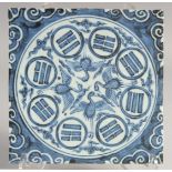 A CHINESE BLUE AND WHITE GLAZED TEMPLE TILE. 19.5cm square