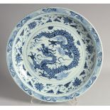 A VERY LARGE CHINESE BLUE AND WHITE PORCELAIN DRAGON CHARGER, the central dragon with a border of