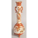 A JAPANESE KUTANI PORCELAIN VASE, with tall cylindrical neck and twin handles, painted with