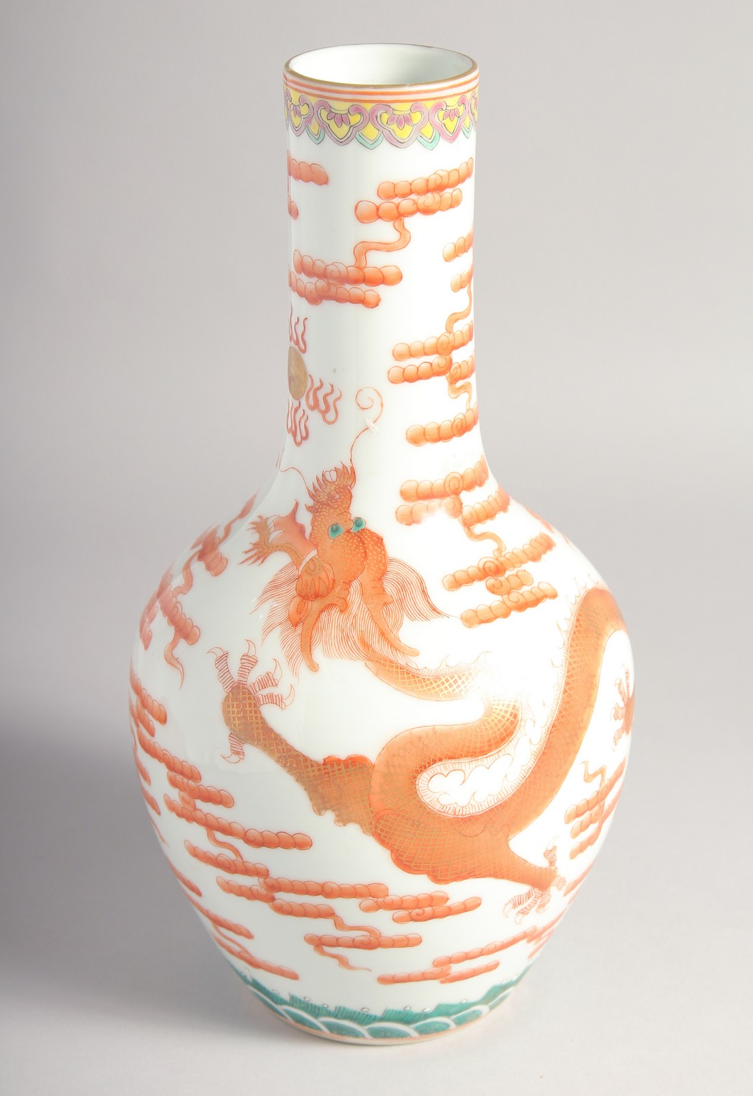 A CHINESE CORAL RED AND WHITE PORCELAIN VASE, painted with a dragon chasing the flaming pearl of