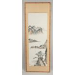 A FRAMED CHINESE SCROLL PAINTING ON PAPER, depicting a mountainous landscape, with red seal mark