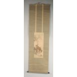 A JAPANESE HANGING SCROLL PAINTING ON SILK, depicting a monkey upon a stag in a woodland scene,