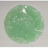 A SMALL CHINESE CARVED AND PIERCED JADE PENDANT, 3cm.