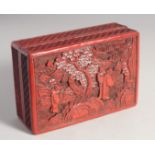 A CHINESE CINNABAR LACQUER RECTANGULAR BOX, the lid decorated with figures in an outdoor setting,