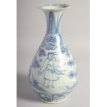 A CHINESE BLUE AND WHITE PORCELAIN VASE, decorated with figures in an outdoor setting, 29.5cm high.