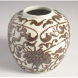 A CHINESE GLAZED POTTERY GINGER JAR, with relief floral decoration, 12cm high.