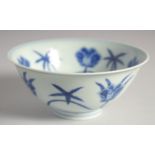 A CHINESE BLUE AND WHITE PORCELAIN BOWL, decorated with large flower heads, 15cm diameter.