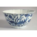 A CHINESE BLUE AND WHITE PORCELAIN PETAL FORM BOWL, painted with fish and aquatic flora, six-