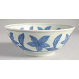 A CHINESE BLUE AND WHITE PORCELAIN BOWL decorated with large central flower head and further foliate