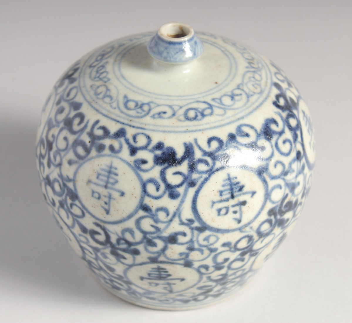 A SMALL CHINESE BLUE AND WHITE PORCELAIN BULBOUS VASE, painted with characters, 11.5cm high. - Image 3 of 6