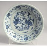A CHINESE BLUE AND WHITE PORCELAIN BOWL, the interior centre painted with phoenix and further