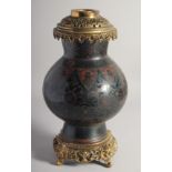 A JAPANESE BLACK GROUND CLOISONNE VASE / LAMP, with pierced metal mounts, decorated with flower head