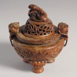 AN UNUSUAL CARVED WOOD TRIPOD CENSER AND COVER, 15cm high.