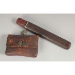 A JAPANESE TOBACCO PIPE SET; comprising pipe, wood and red lacquer case, and leather tobacco pouch
