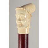 A CARVED BONE HANDLE WALKING STICK "HEAD".