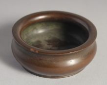 A SMALL CHINESE BRONZE CIRCULAR CENSER. 2.24ins.