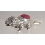 A SILVER BEAVER PIN CUSHION.