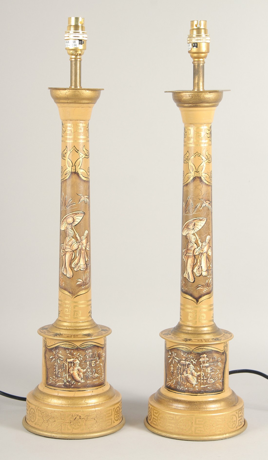 A PAIR OF TOLEWARE LAMPS with Chinese design. 24ins high with electric fittings.