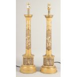 A PAIR OF TOLEWARE LAMPS with Chinese design. 24ins high with electric fittings.