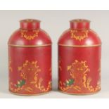 A PAIR OF TOLEWARE TEA TINS AND COVERS. 15ins high.