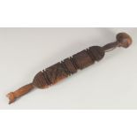 A SOUTH SEAS CARVED CLUB OR PADDLE. 2ft 3ins long.